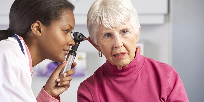 doctor checking patient ears